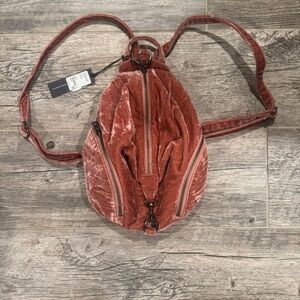 Velvet Backpack in Rust by Rebecca minkhoff